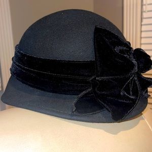 Beautiful ADORA Black cloche hat with black velvet ribbon.